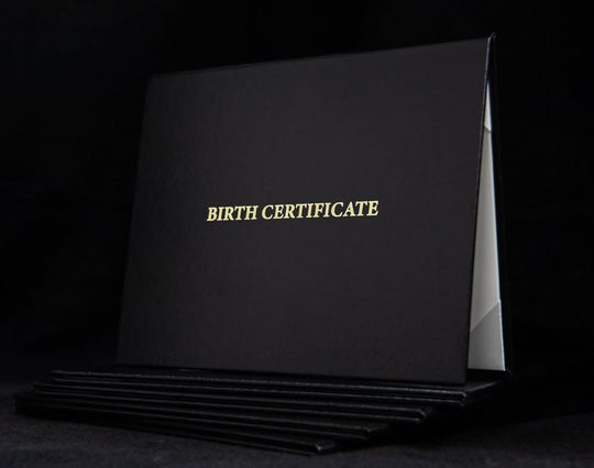 Custom engraved cover for birth certificate by Hey Congrats! features elegant design and personalized engraving on durable material.
