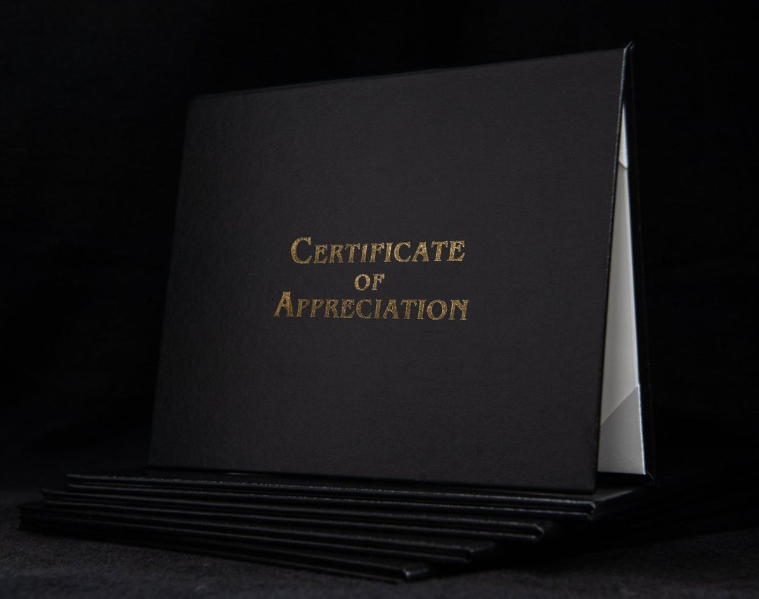Engraved cover for Certificate of Appreciation by Hey Congrats!, featuring elegant design and personalized lettering on a sleek surface.