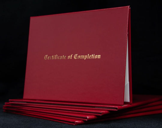 Engraved cover with "Certificate of Completion" text, designed to protect and display a professional achievement certificate.