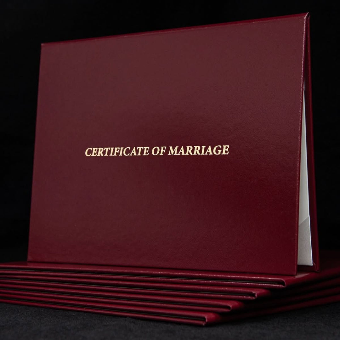 Engraved marriage certificate cover with elegant design and "Certificate of Marriage" text for a formal wedding keepsake.