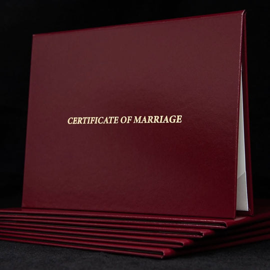Engraved marriage certificate cover with elegant design and "Certificate of Marriage" text for a formal wedding keepsake.