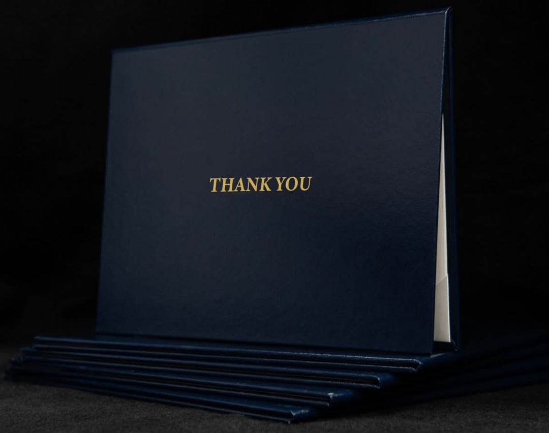 Custom engraved cover with "Thank You" message from Hey Congrats! featuring a sleek, personalized design for special occasions.