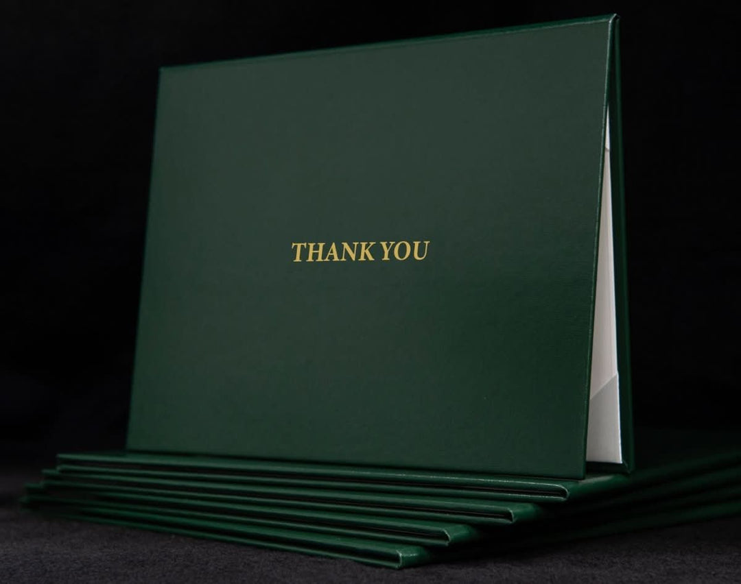 Custom engraved cover with "Thank You" message by Hey Congrats! featuring a sleek design and personalized engraved details.