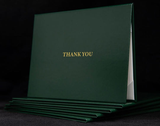 Custom engraved cover with "Thank You" message by Hey Congrats! featuring a sleek design and personalized engraved details.